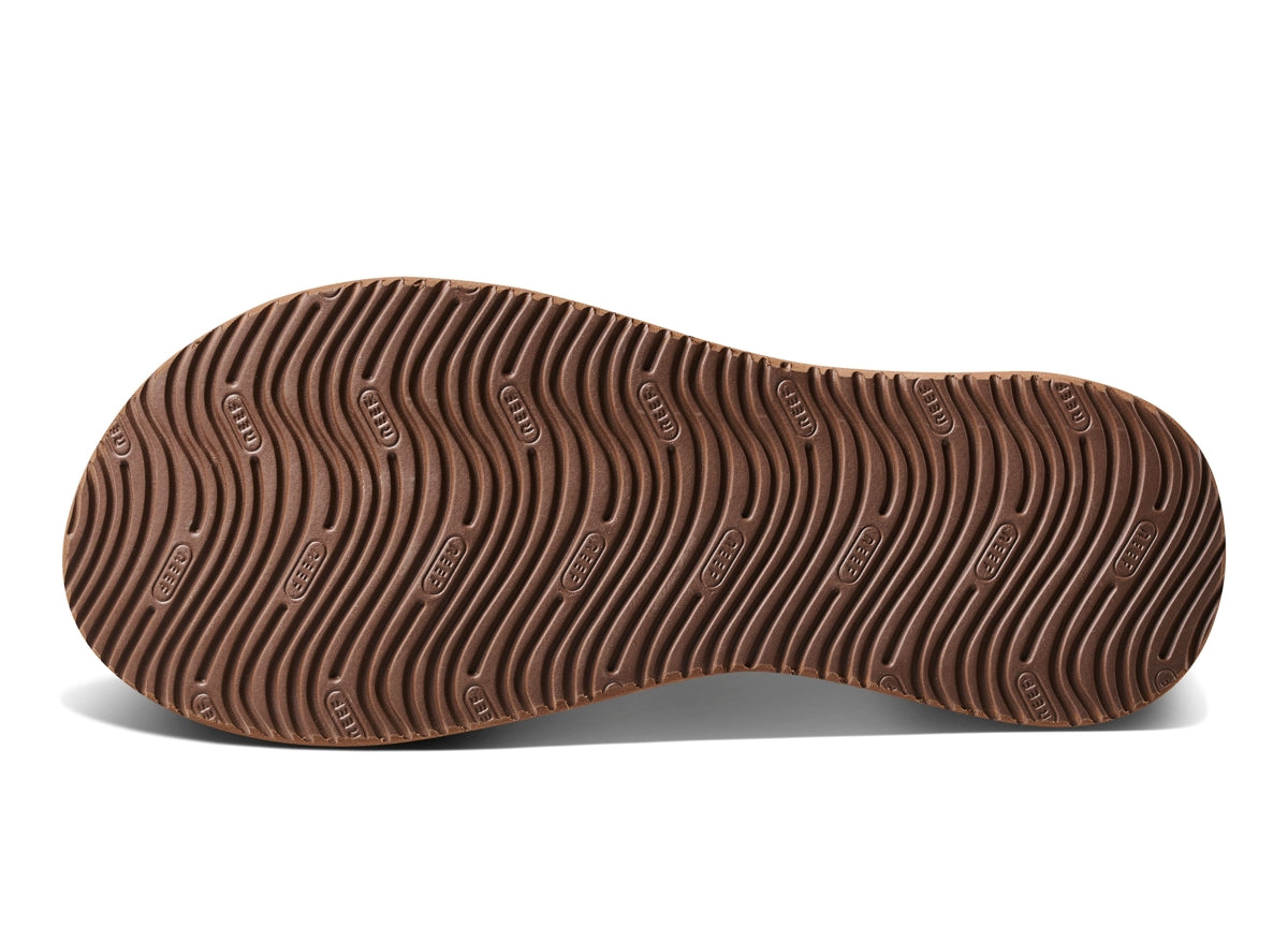 Sole of Reef Mens Cushion Phantom Flip Flops featuring wave patterns for traction and comfort