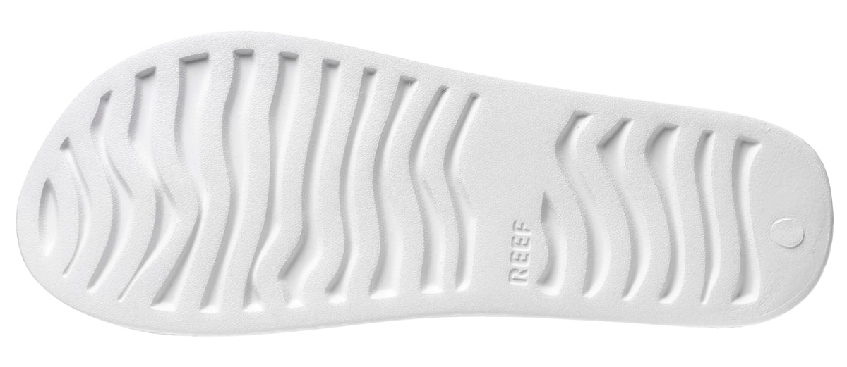 Close-up of the sole of Reef Womens Slide Sandals White showing textured grip pattern