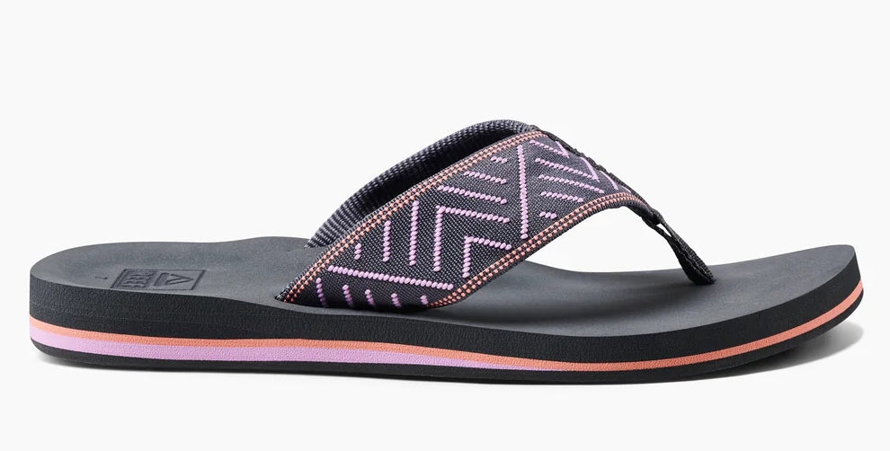 Side view of Reef womens spring woven grey flop flops with cushioned sole and patterned fabric straps