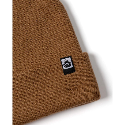 Brown knit Saltrock beanie with a logo tag on a white background