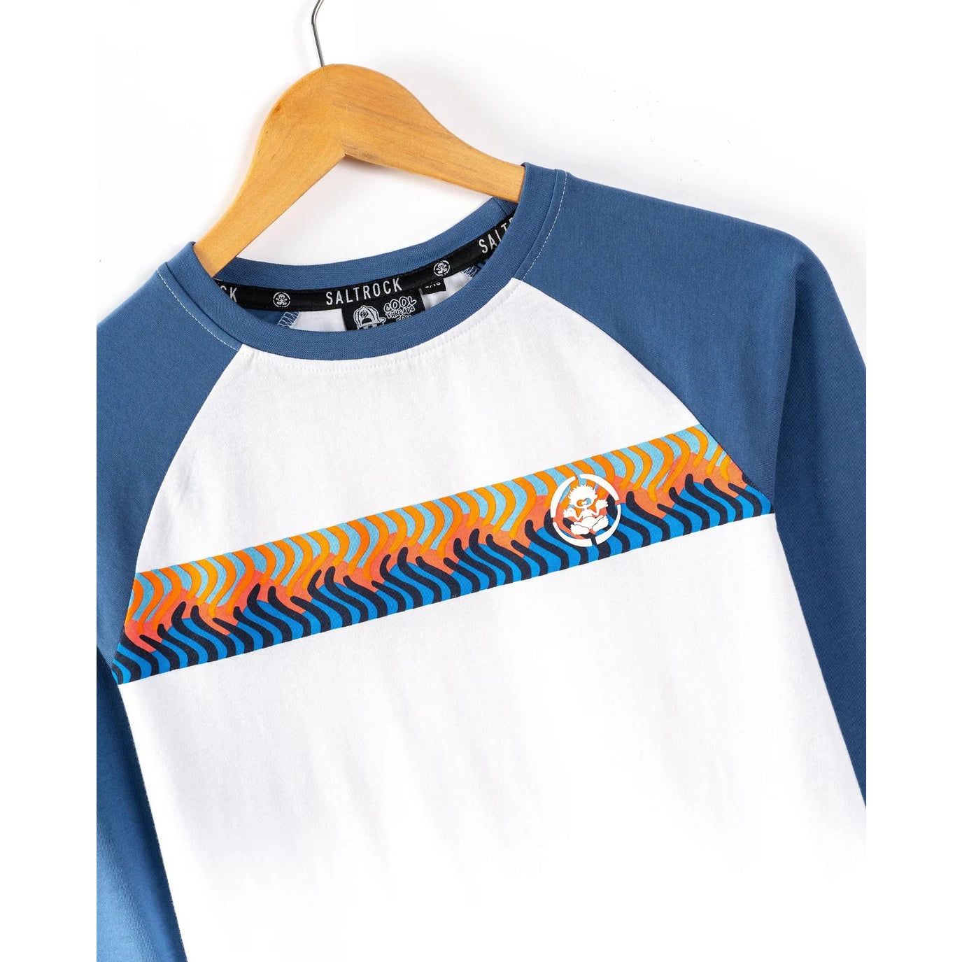 Saltrock kids blue and white t-shirt with colourful printed Wave Stripe design across the chest on a hanger