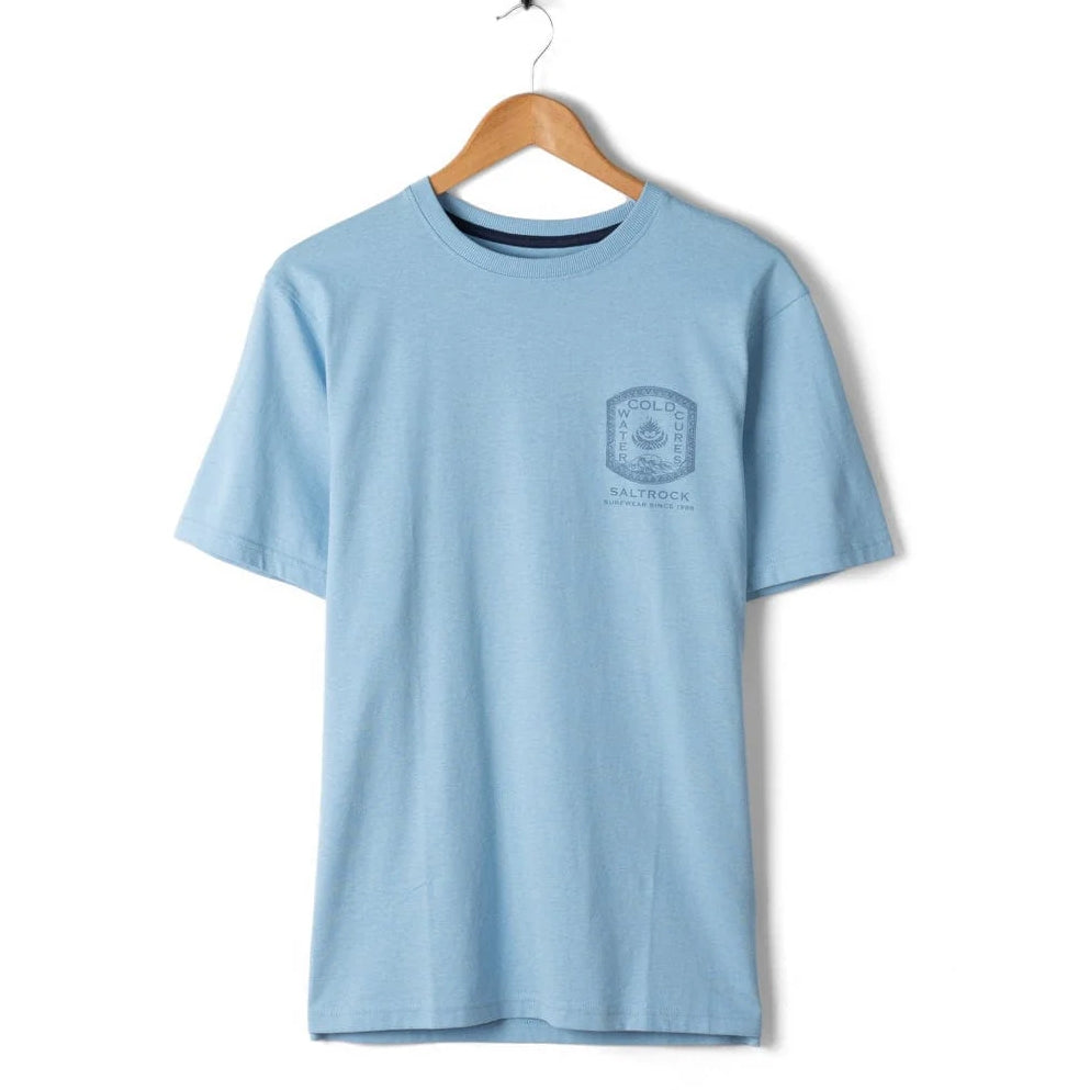 Light blue t-shirt with a logo on a wooden hanger against a white background