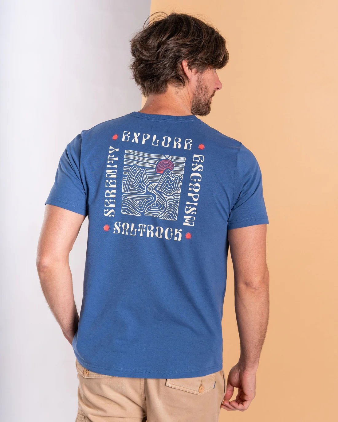 Saltrock mens t-shirt blue featuring a graphic design on the back promoting exploration and escapism