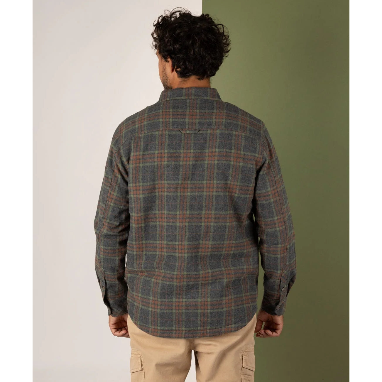 Man wearing a Saltrock grey check shirt with a neutral background