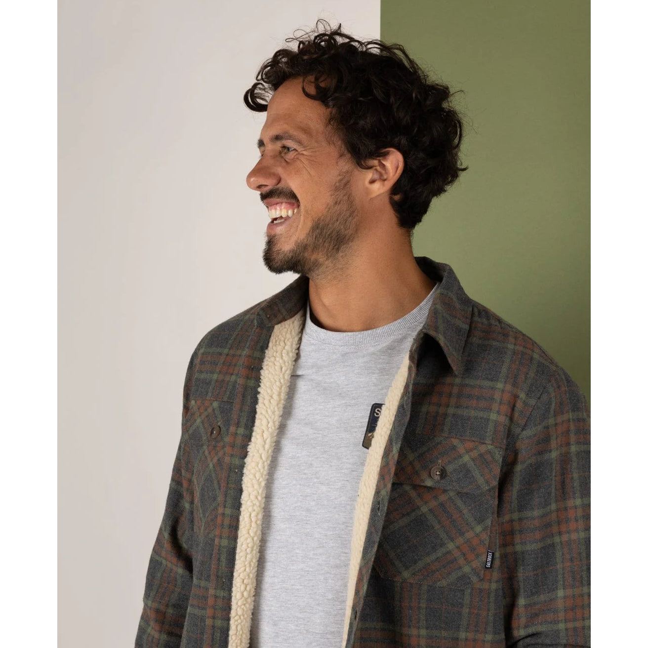 Man wearing a Saltrock Woody grey check shacket, standing against a plain background