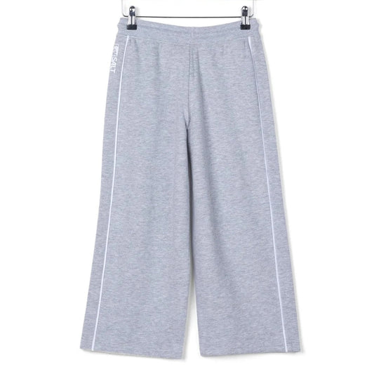 Back view of kids Saltrock Tok Corp jogger trousers in grey with elasticated drawstring waist with white piping down the side of the legs.