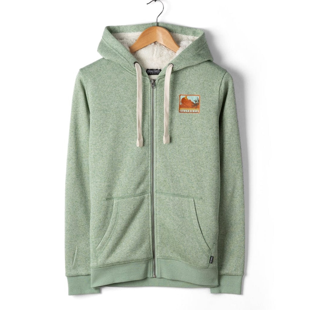 Green Saltrock womens Ayden hoodie with a logo on a hanger against a white background