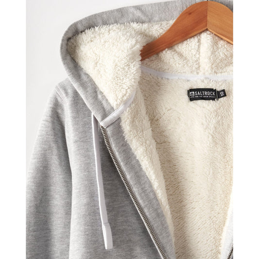 Close-up view of a Saltrock womens full zip Velator grey hoodie with white borg lining on a hanger, featuring a 'Saltrock' brand label.