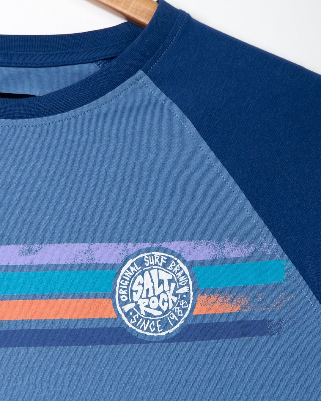 Saltrock men's blue Spray stripe long leeve raglan t-shirt with printed logo on the chest.