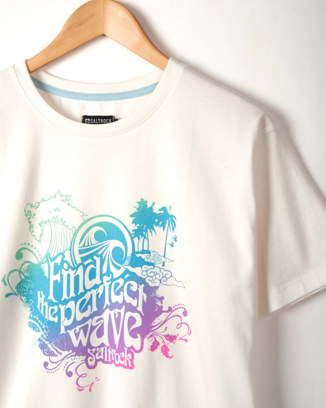 Multicoloured wave and palm tree printed Find the Perfect Wave women's short sleeve t-shirt from Saltrock in White.