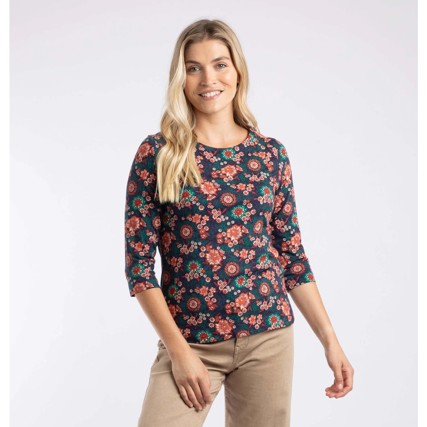 Woman wearing a multicolour Weird Fish floral pattern t-shirt on a white background