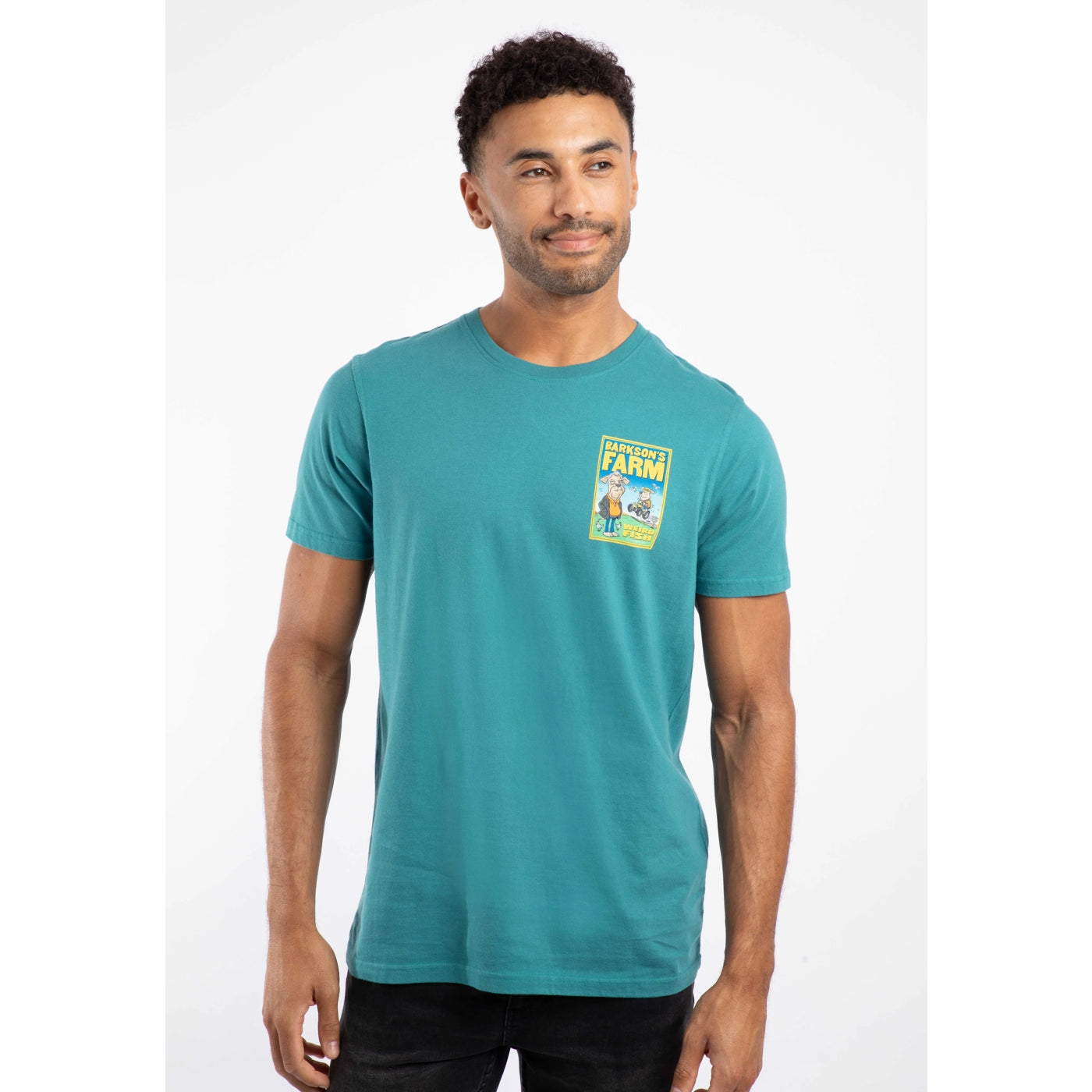 Man wearing a teal Weird Fish t-shirt with a graphic print on a white background