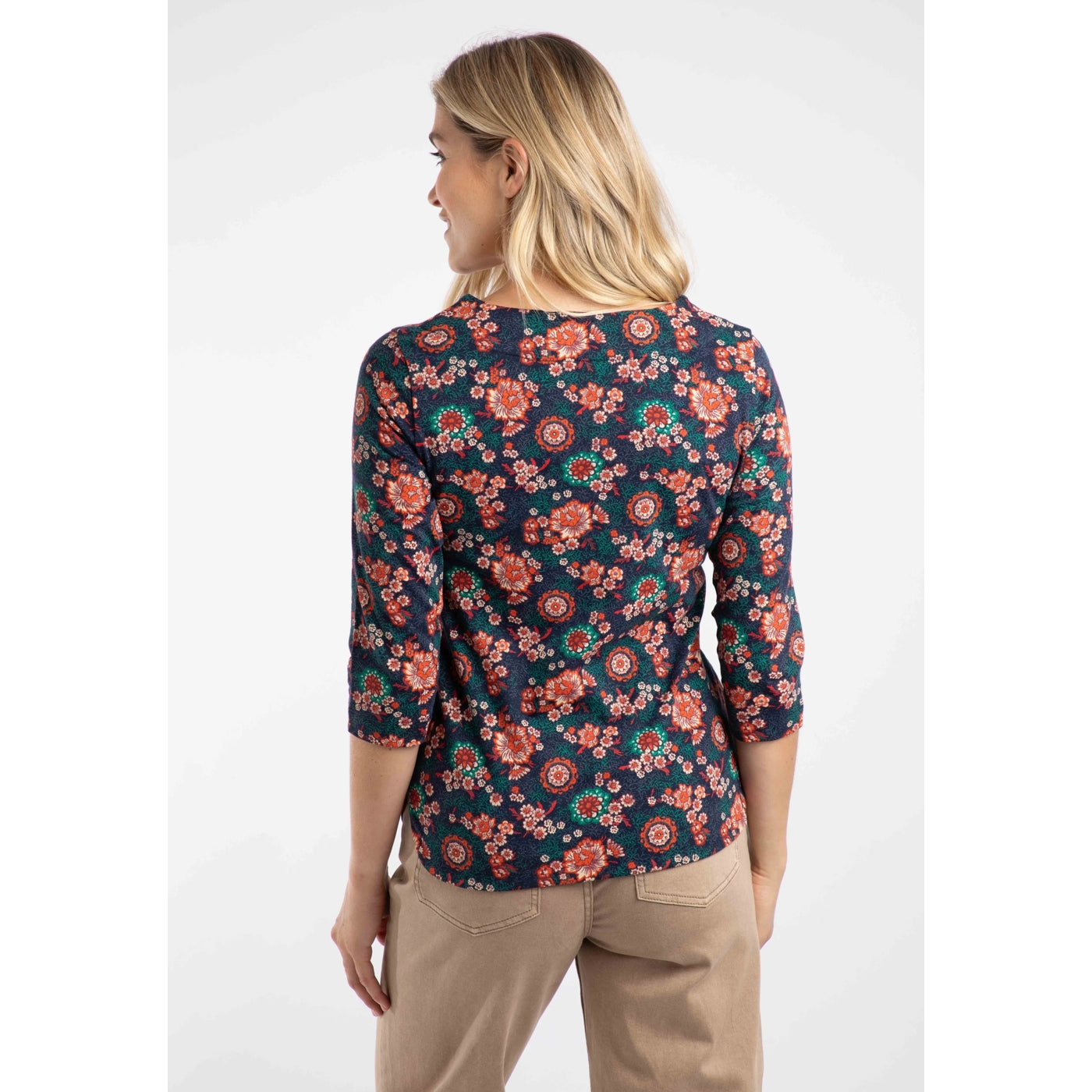 Woman wearing a Weird Fish multicolour floral t-shirt with a white background