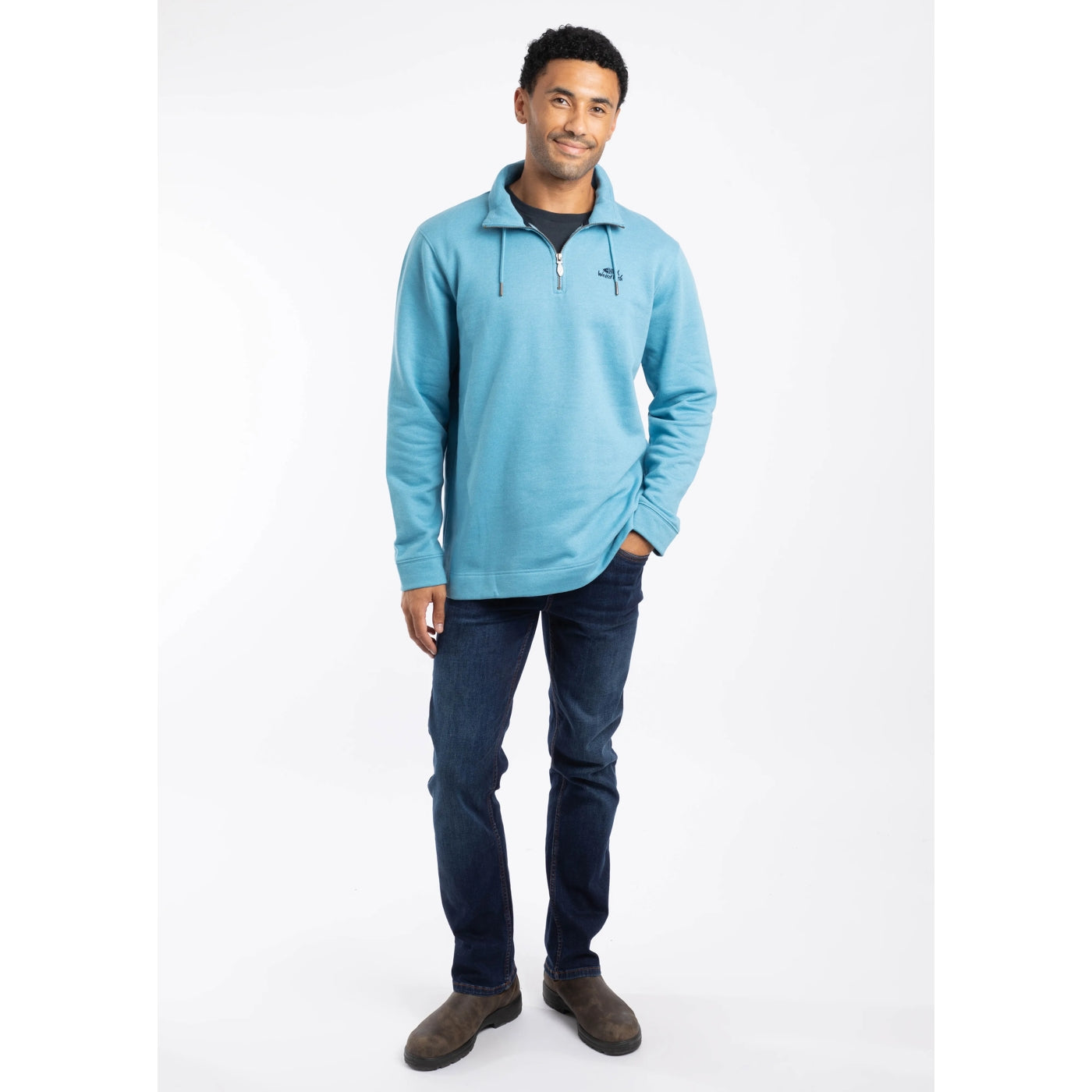 Man wearing a Weird Fish Brampton Smoked Blue sweatshirt with a white background