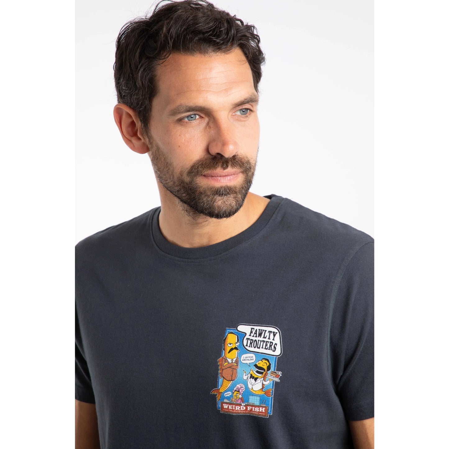 Weird Fish mens Fawlty Trouters T-Shirt Navy with cartoon graphic on chest worn by bearded man