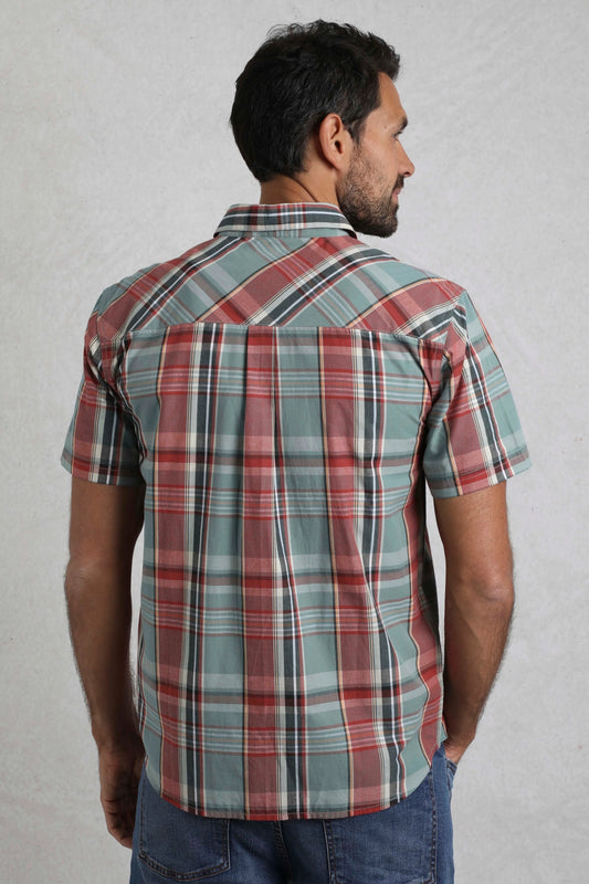 Back view of man wearing Weird Fish mens Judd check shirt Mineral Blue with short sleeves and plaid pattern