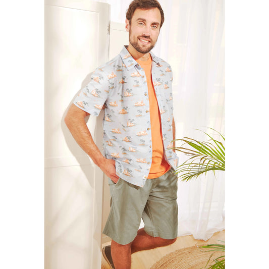 Weird Fish mens Murrisk shorts shadow in green worn by man with patterned shirt and orange t-shirt