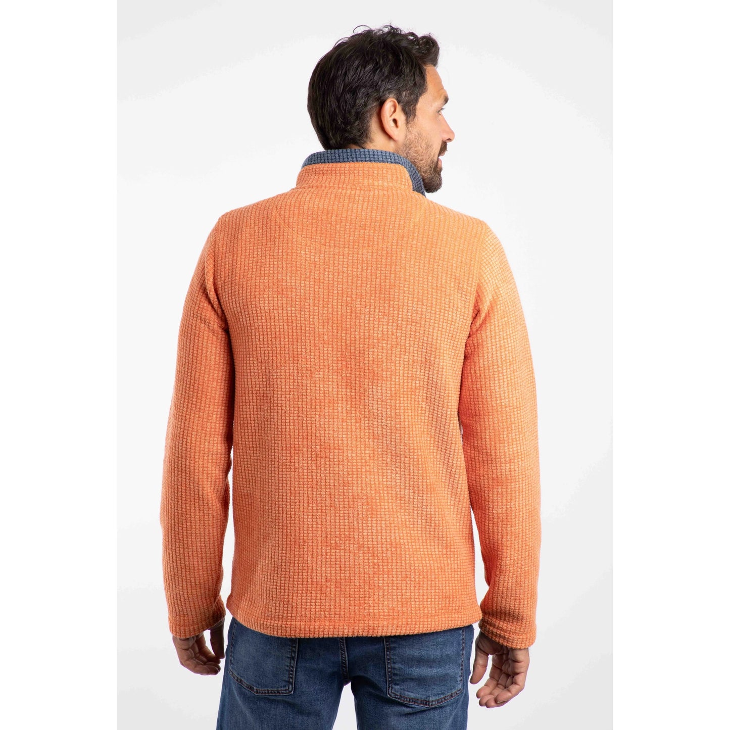 Weird Fish mens Newark grid fleece in Brick Orange shown from the back on a male model wearing jeans