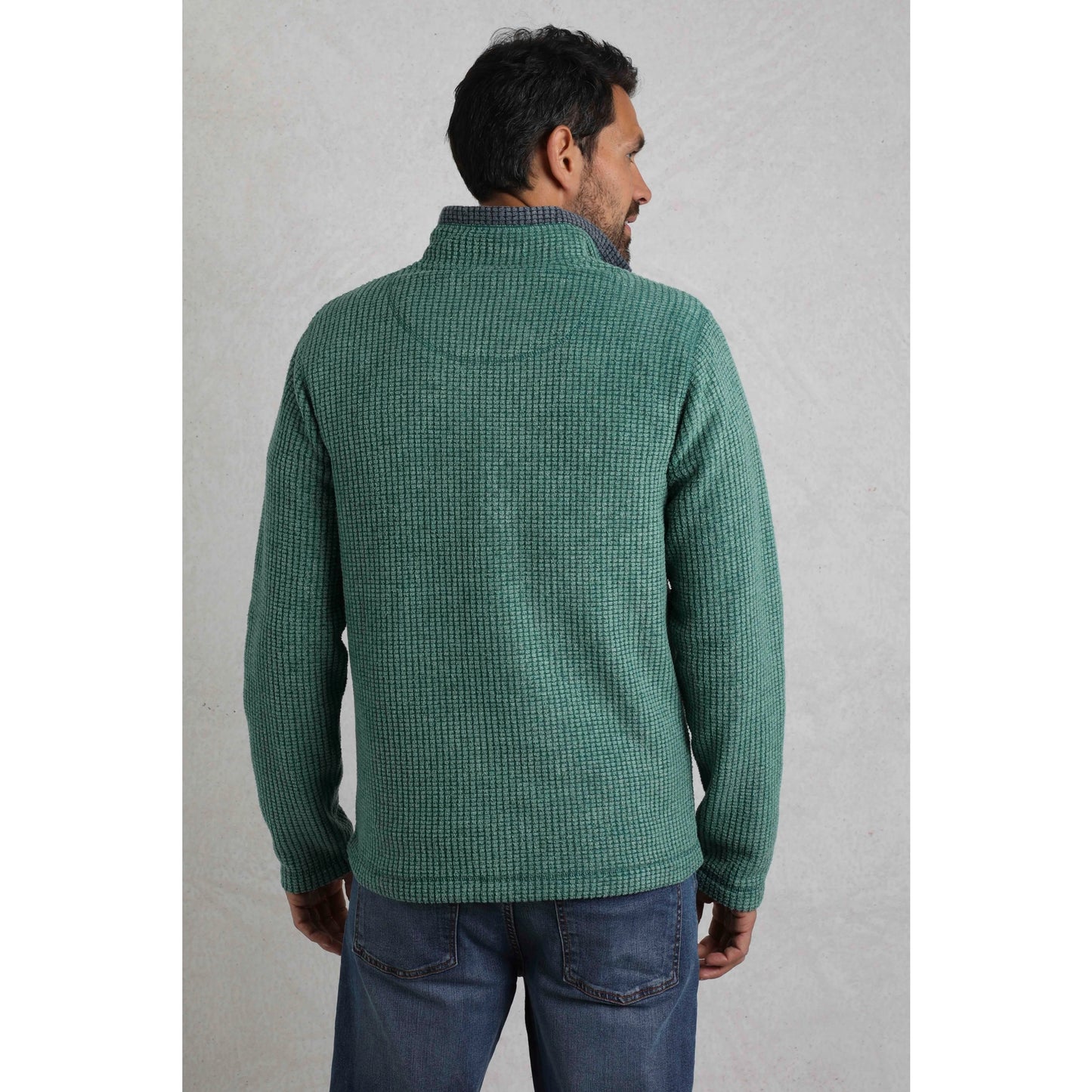 Back view of man wearing Weird Fish mens Newark grid fleece in Leaf Green in casual outfit