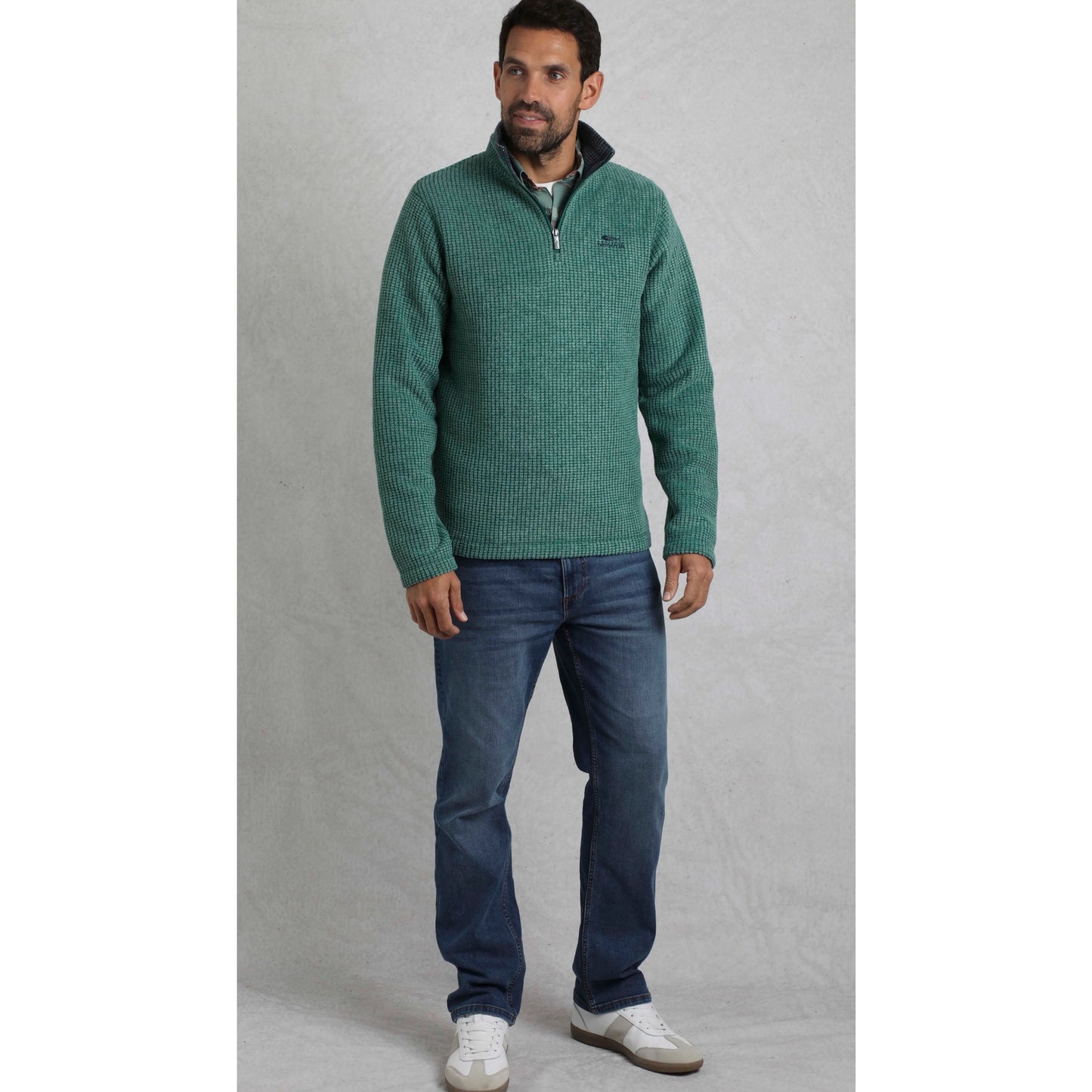 Weird Fish mens Newark grid fleece in Leaf Green worn by male model with zipper collar.