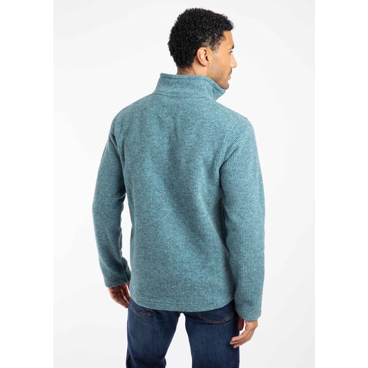 Man wearing a blue Weird Fish Newport fleece on a white background