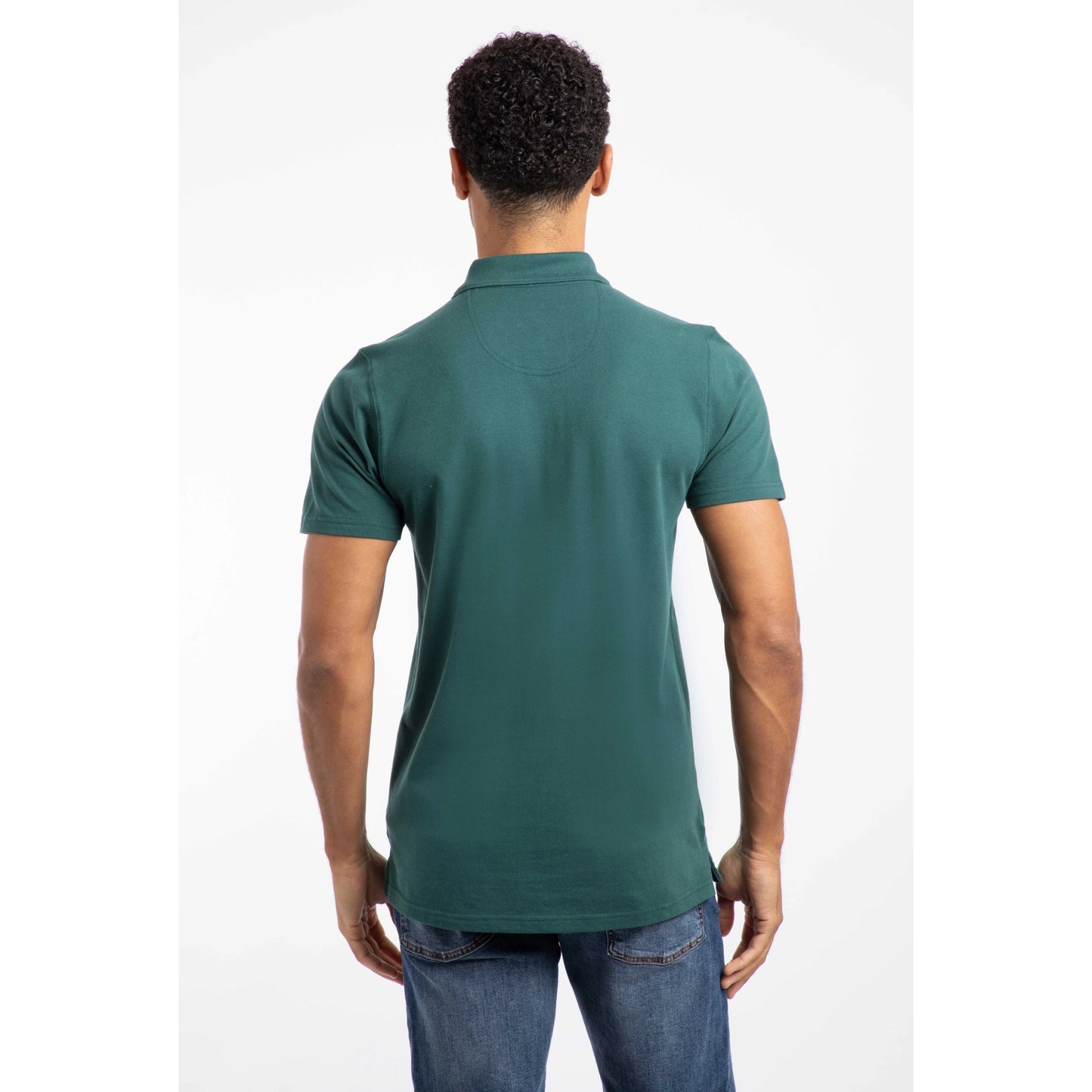Back view of man wearing Weird Fish mens polo shirt Forest Green paired with blue jeans