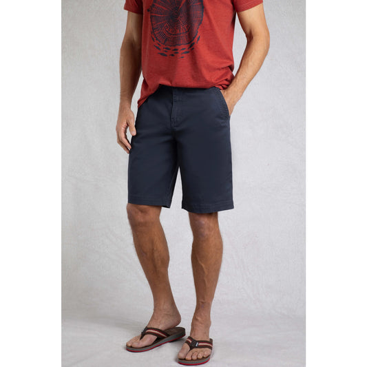 Front view of Weird Fish mens Rayburn navy chino shorts worn by a man paired with a red graphic t-shirt and sandals