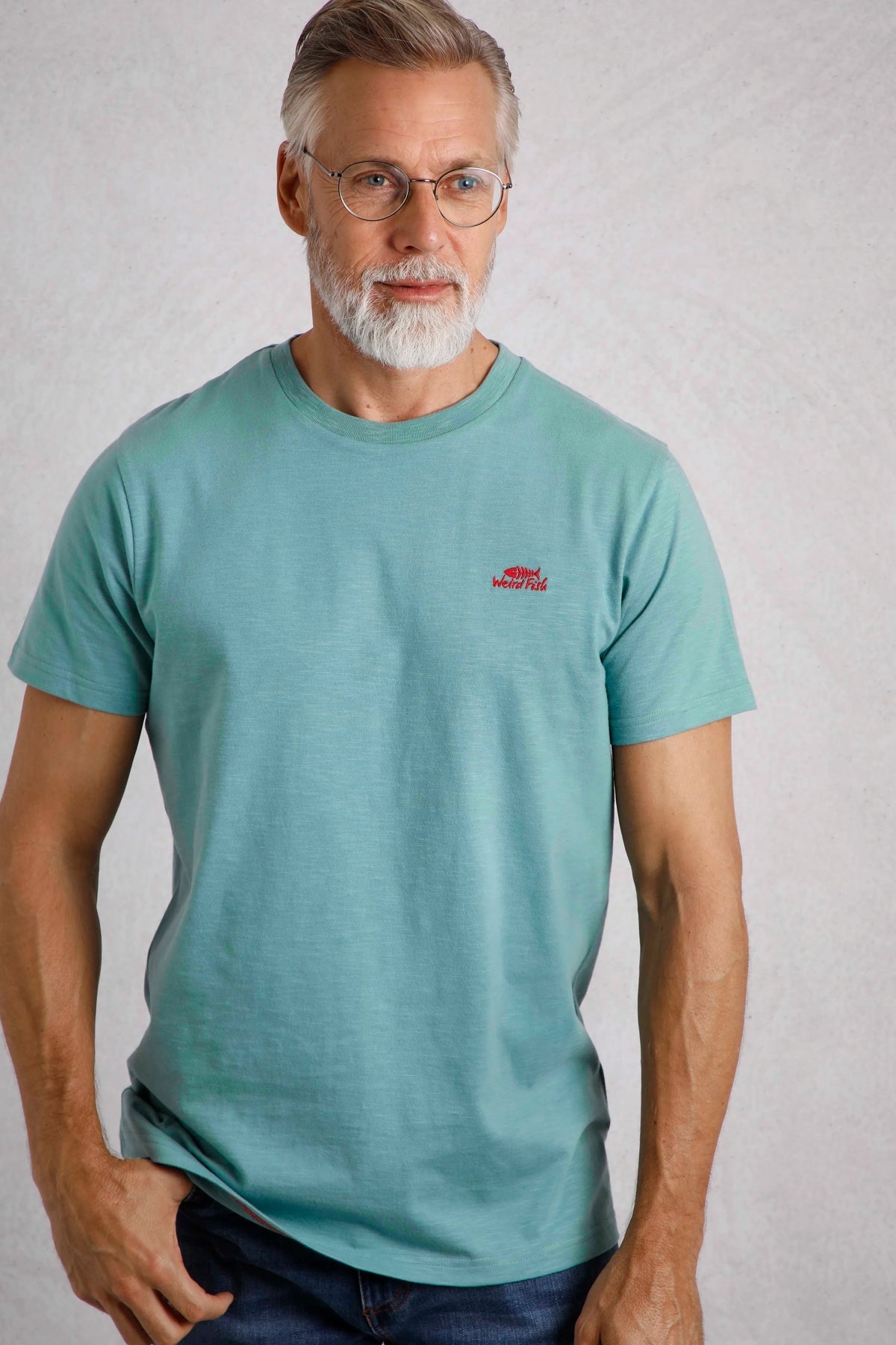 Weird Fish mens t-shirt blue worn by man with short sleeves and small red logo on chest