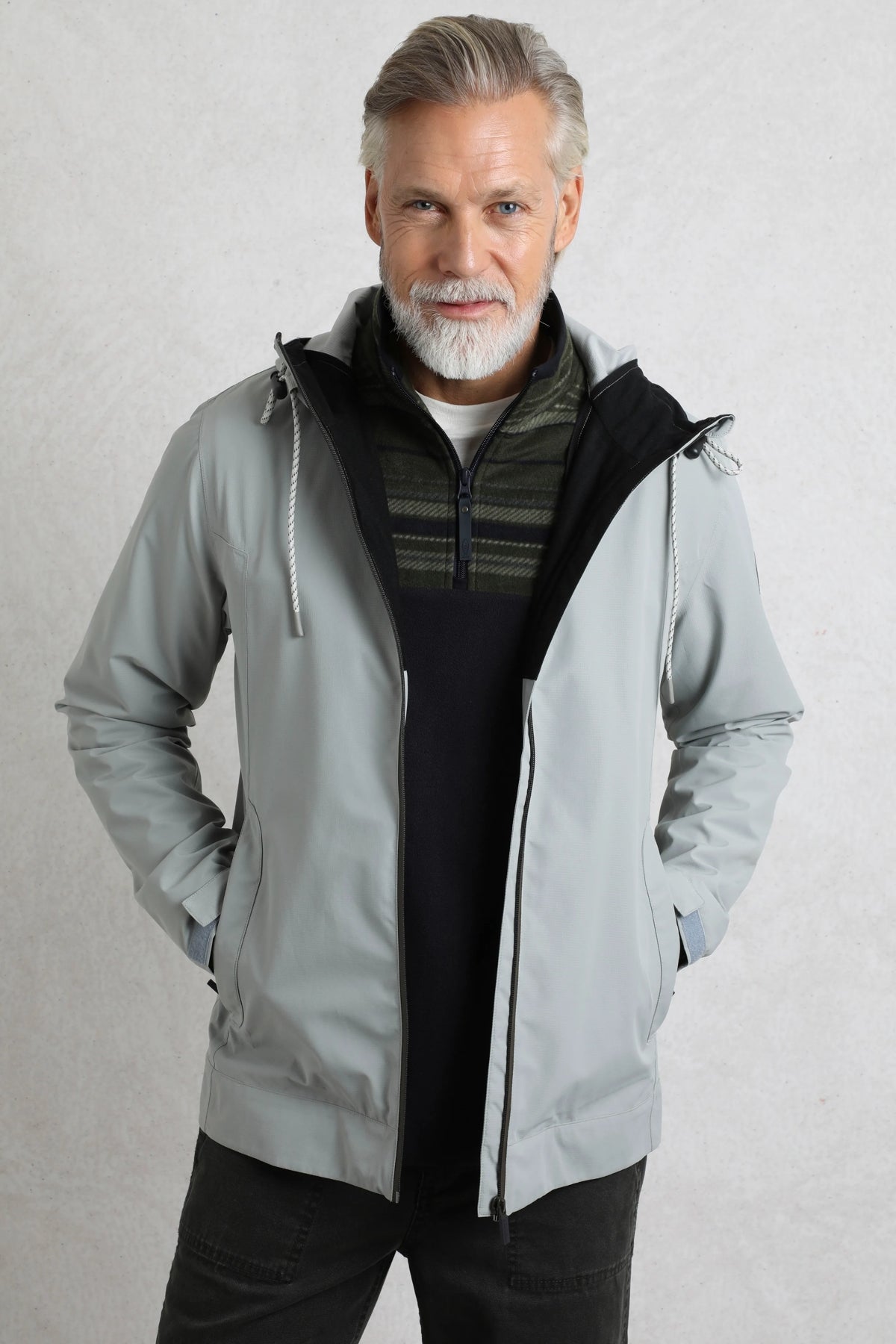 Weird Fish mens waterproof jacket grey worn by man with zip and hood in casual style