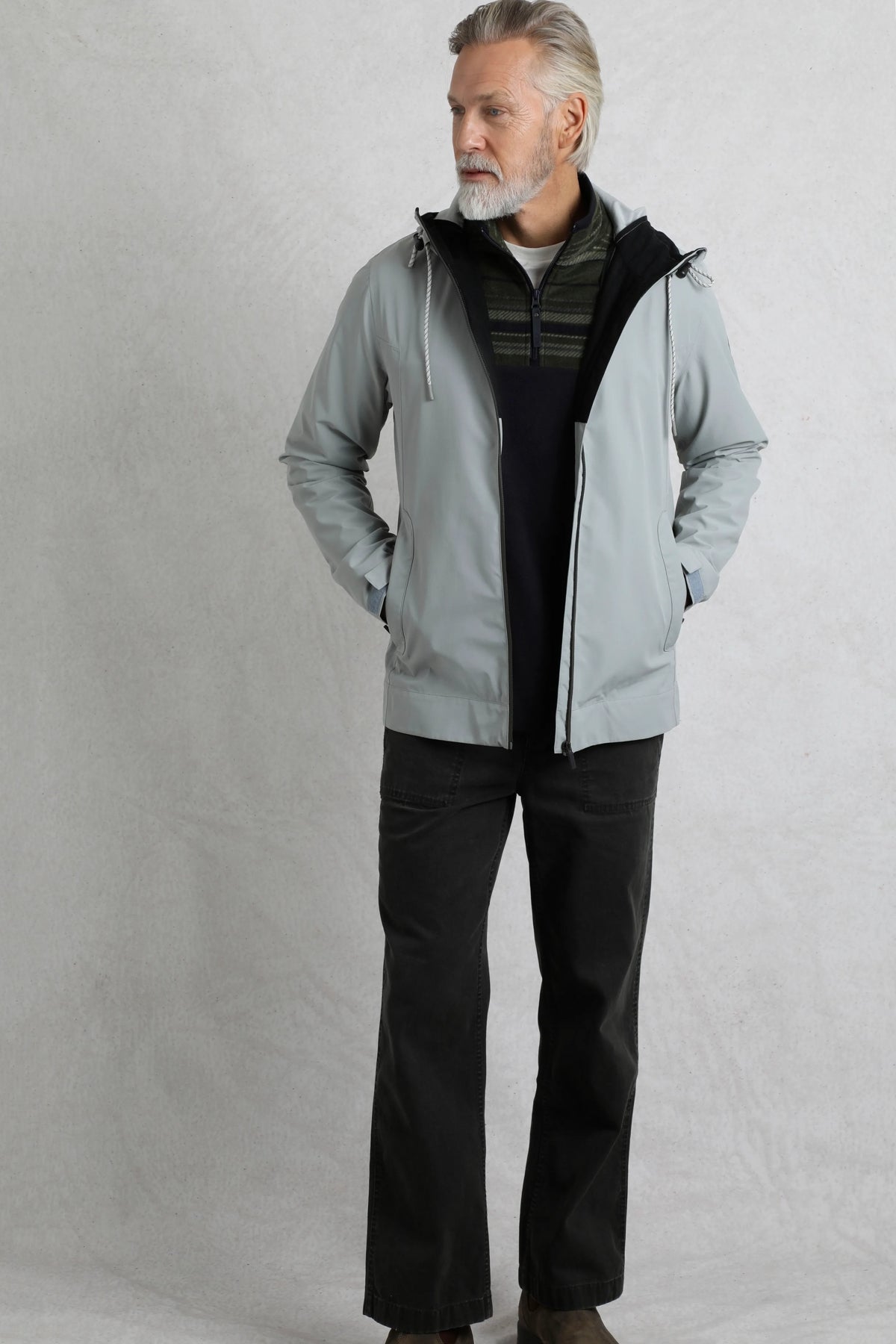 Weird Fish mens waterproof jacket grey worn by man with hands in pockets