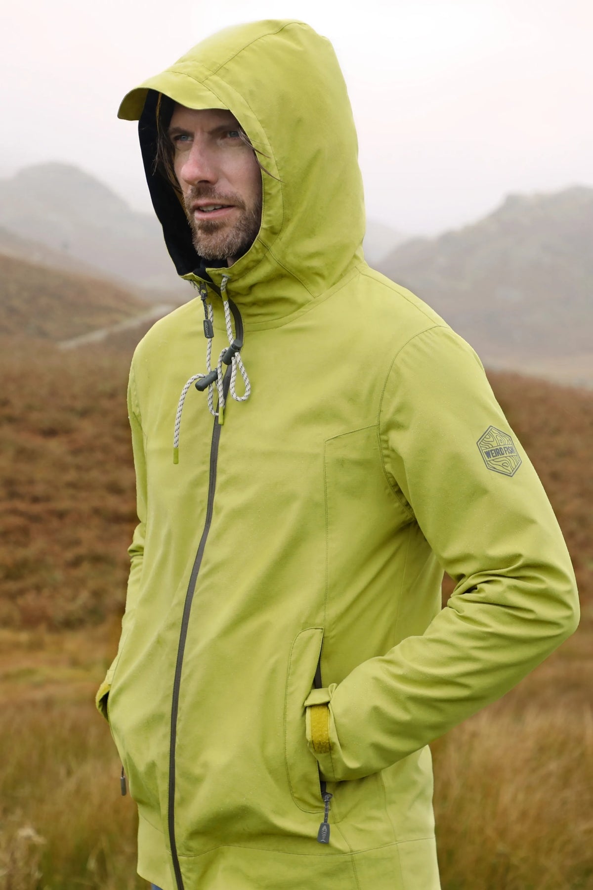 Weird Fish mens waterproof jacket tarragon in light green with hood and zip closure outdoor wear