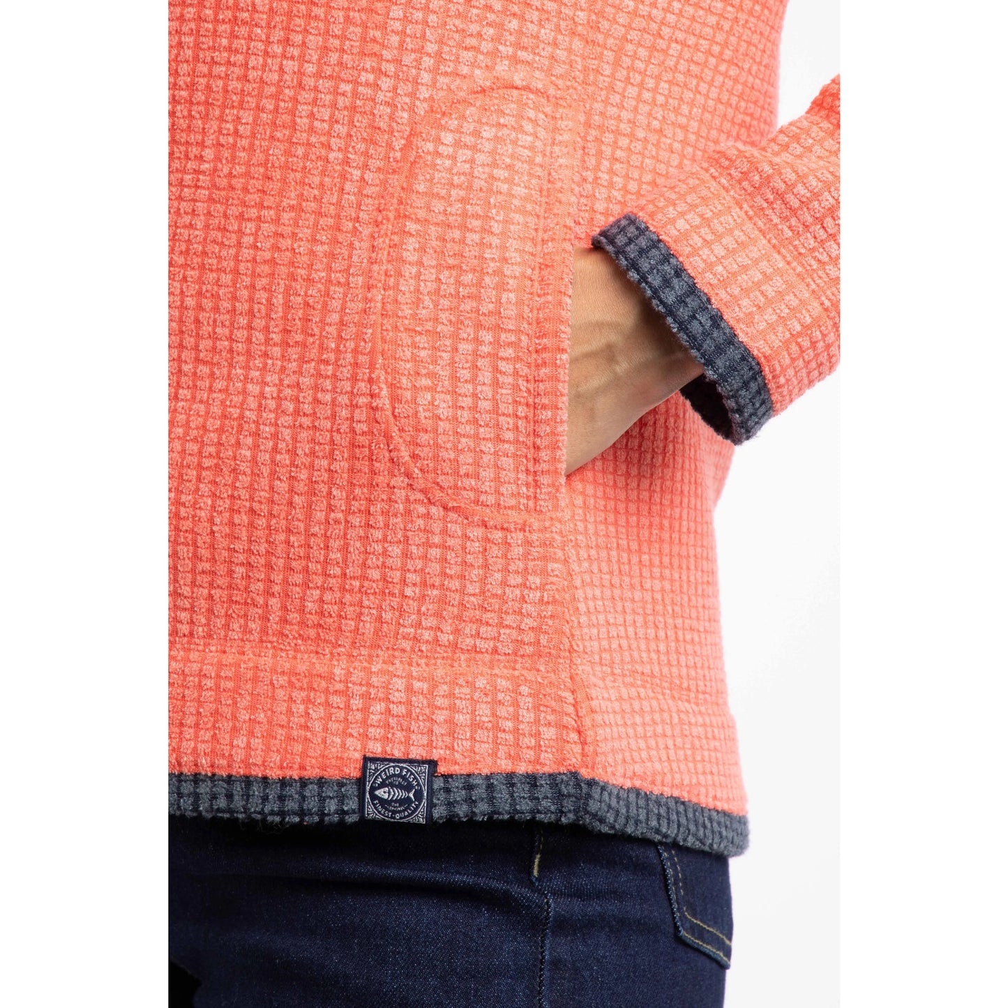 Weird Fish womens Ariana full zip grid fleece coral textured close-up showing pocket and hem detailing