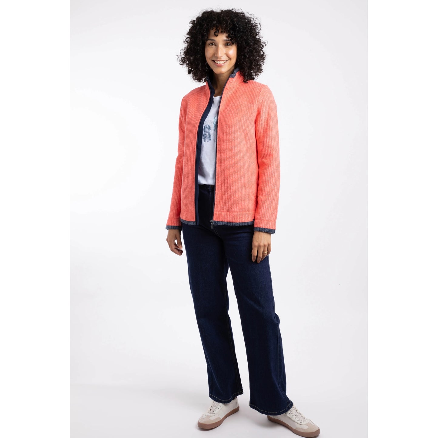 Weird Fish womens Ariana full zip grid fleece coral worn by woman with curly hair and casual outfit