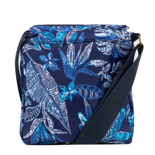 Back view of a Weird Fish Kait cross body bag in navy with a blue tropical leaf print and adjustable shoulder strap.
