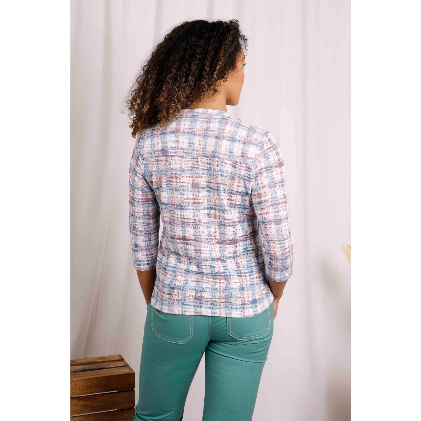Back view of Weird Fish womens Fes check shirt in Pale Denim Blue worn by a woman with three-quarter sleeves