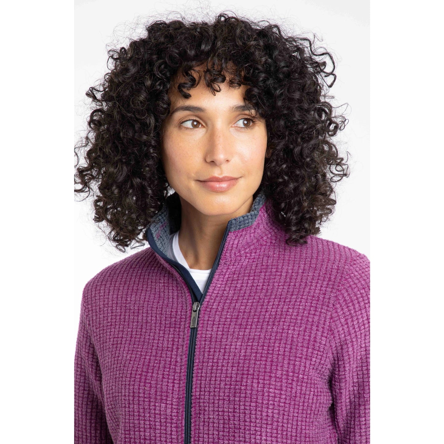 Weird Fish womens Ariana grid fleece purple wine textured zip-up jacket on model with curly hair