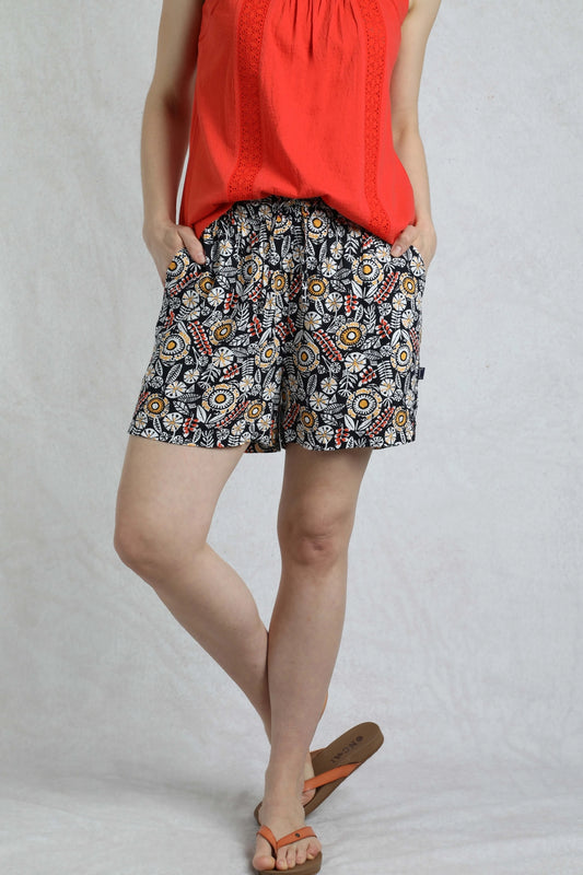 Weird Fish womens navy floral shorts with colorful print worn with red top and sandals