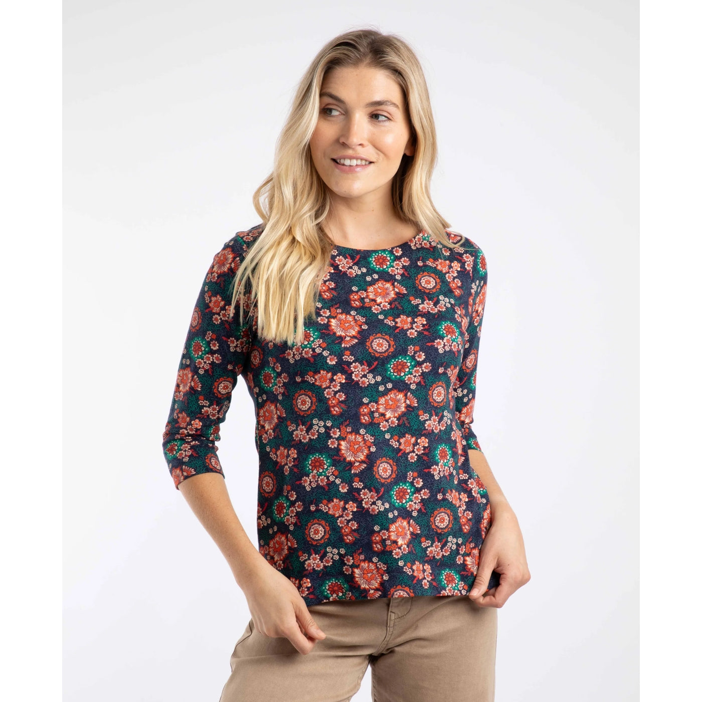 Woman wearing a Weird Fish Pinto 3/4 sleeve t-shirt in a floral pattern on a white background