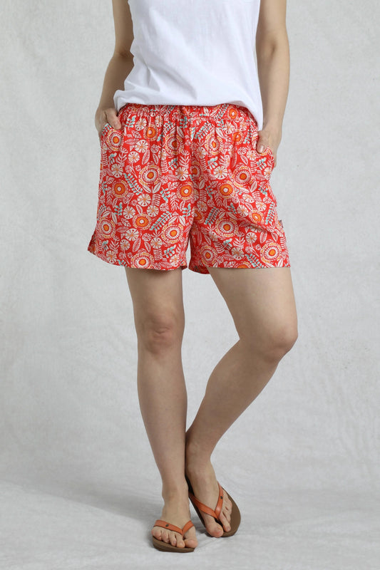 Weird Fish womens red floral shorts with elastic waist and pockets styled with white top and sandals