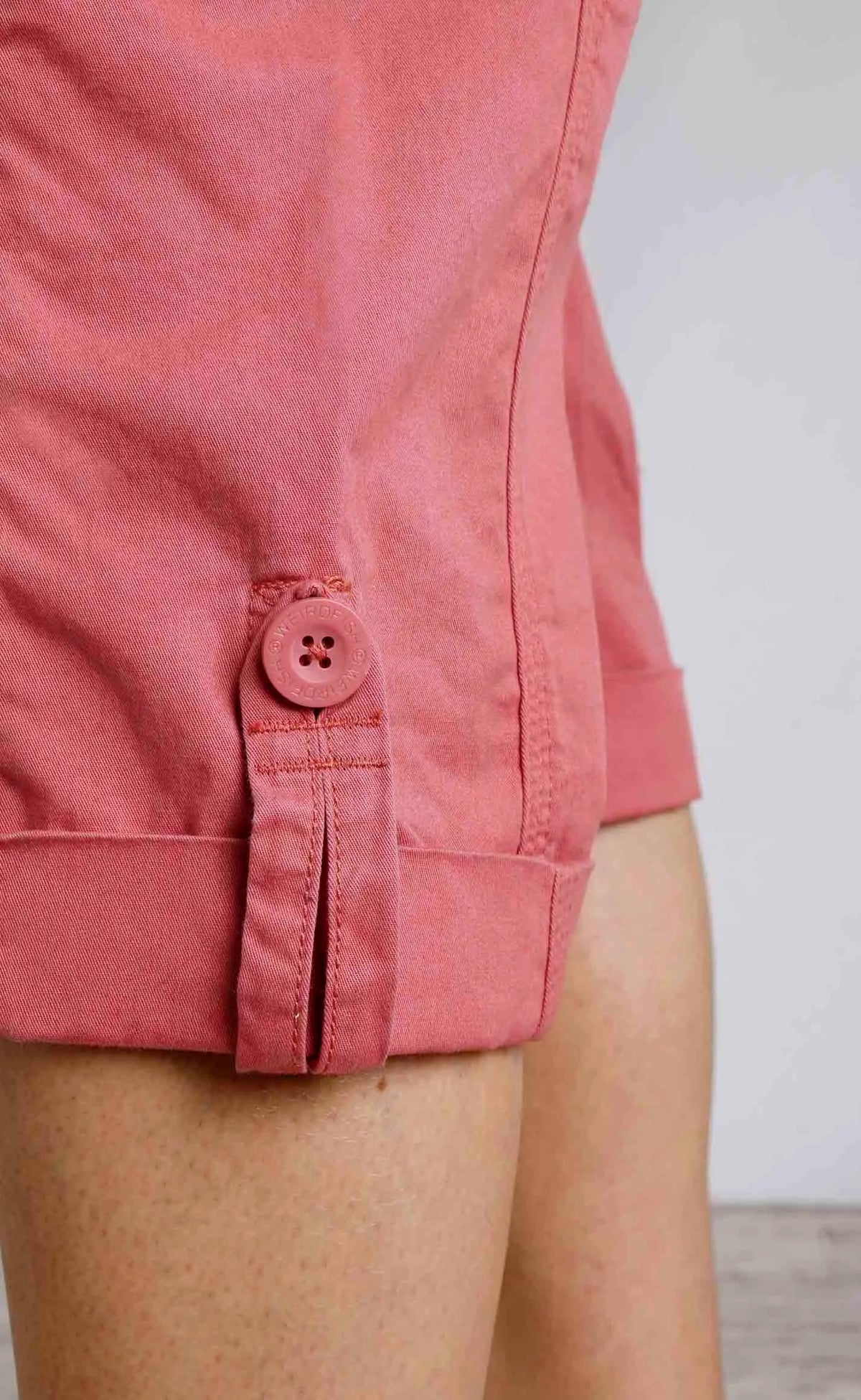 Weird Fish women's Salena cotton crop trousers in Rosewood Pink with turn up legs.