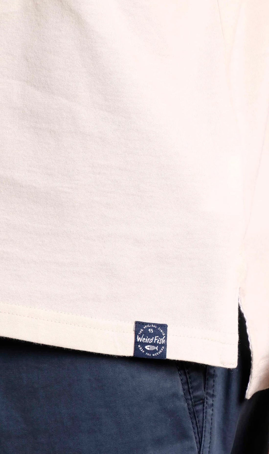 Weird Fish men's Albury polo shirt in Radical Red with hem logo label.