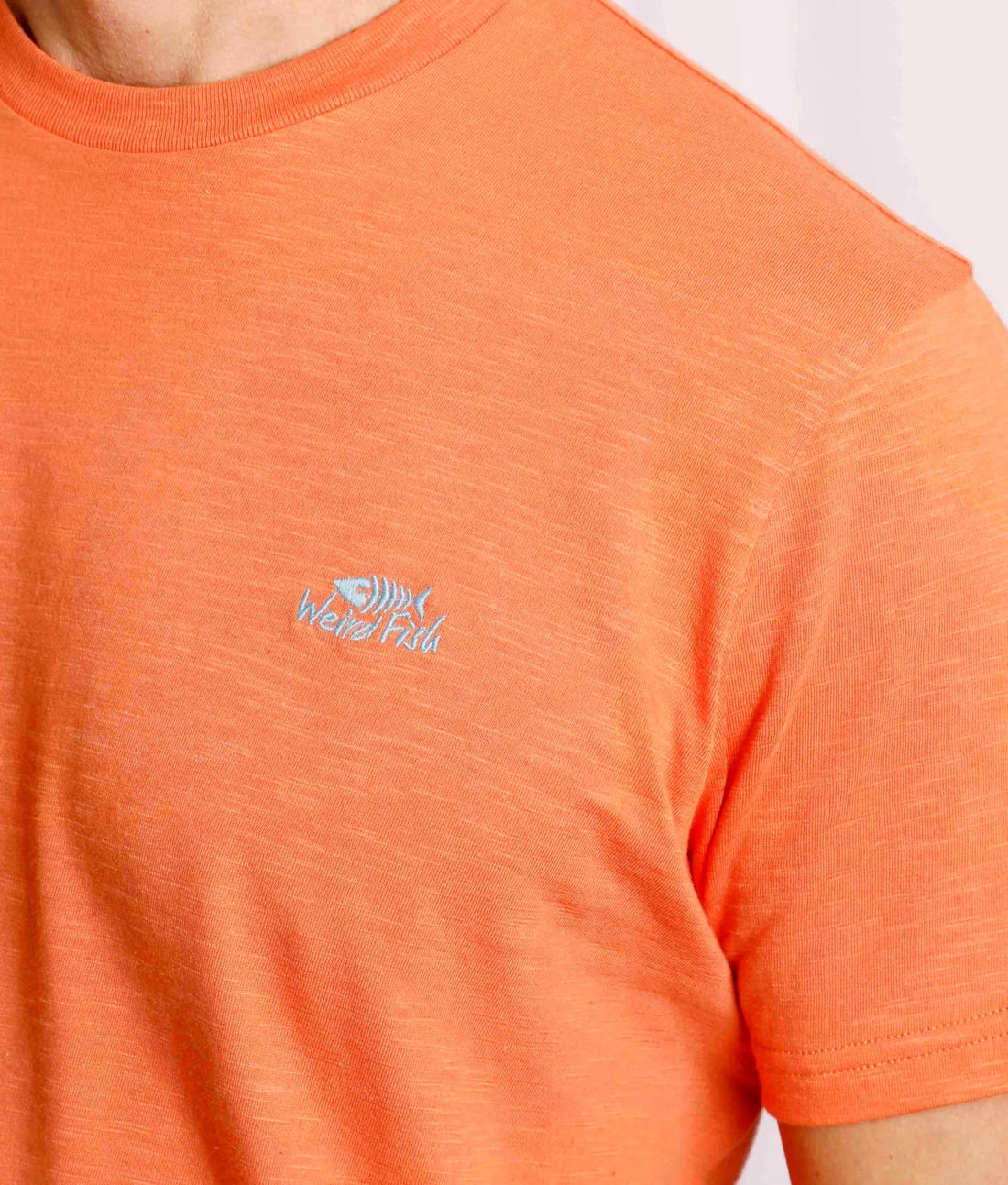 Weird Fish men's Mango Orange coloured Fished t-shirt with contrast coloured chest emblem.