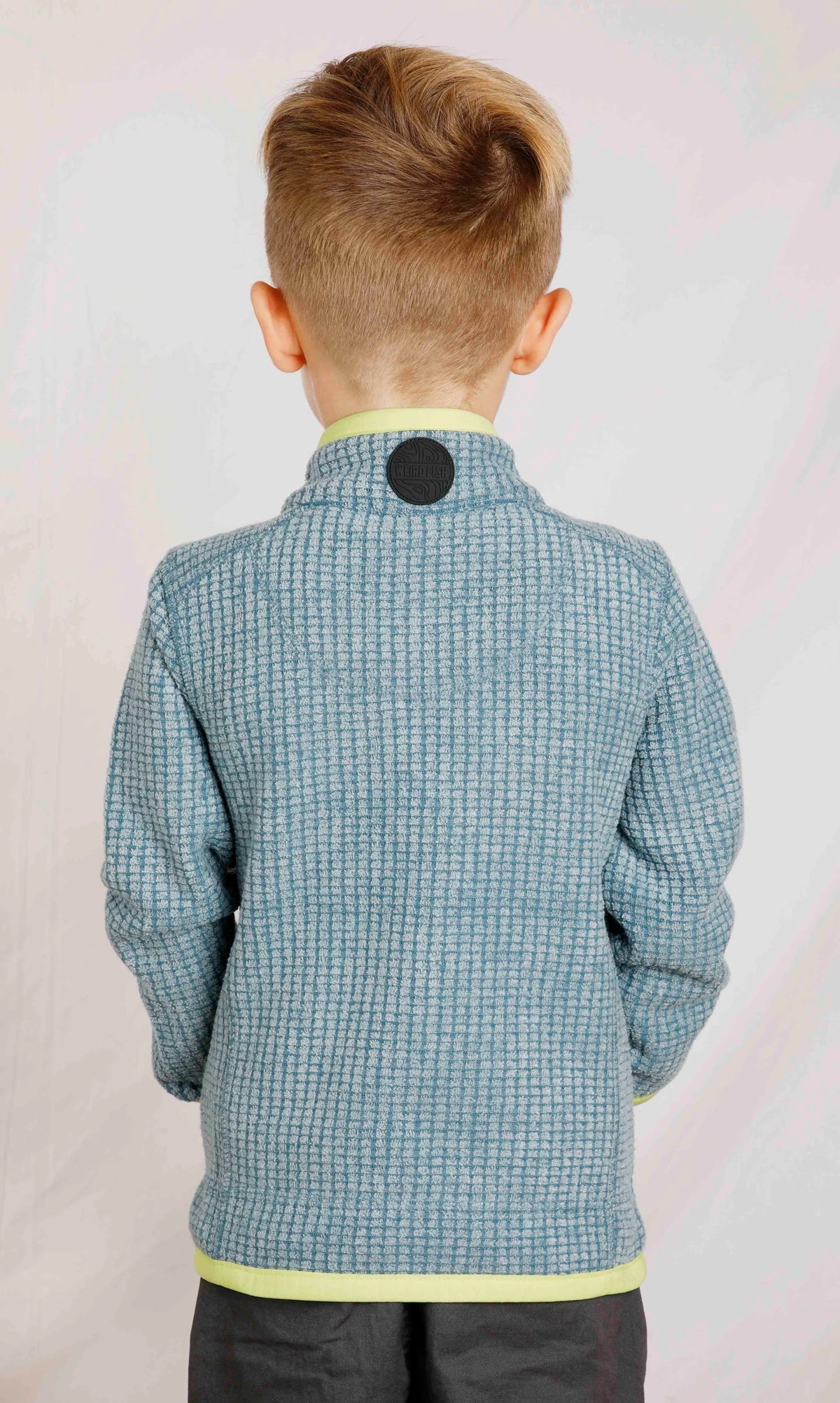 Weird Fish childrens Archie grid fleece in Uniform Blue with rubber logo collar patch.