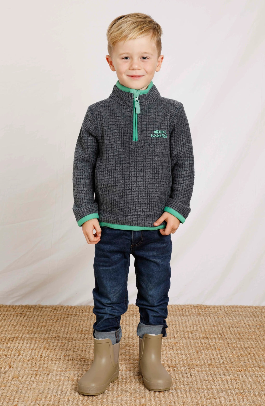 Kids Weird Fish Archie 1/4 zip grid fleece in Navy with contrasting green trim.