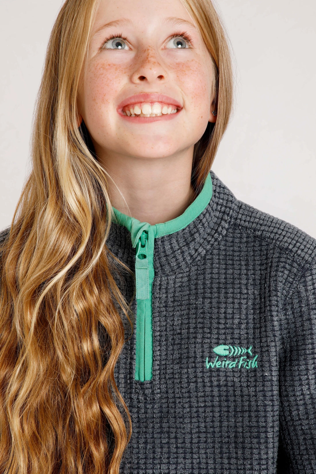 Childrens Weird Fish Navy 1/4 zip grid fleece.