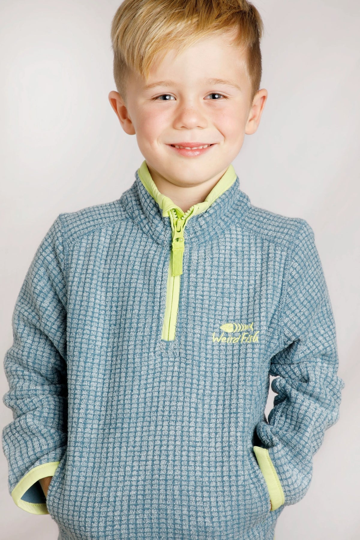 Weird Fish kids Archie Uniform Blue 1/4 zip grid fleece with tummy pockets.