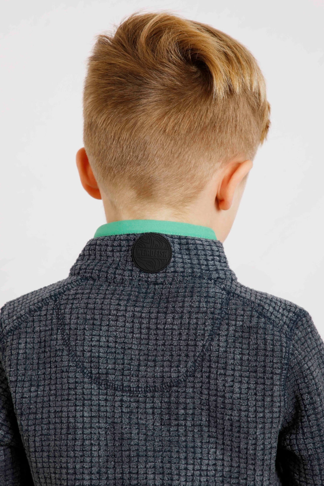 Navy Weird Fish kids Archie fleece with back of the neck logo patch.