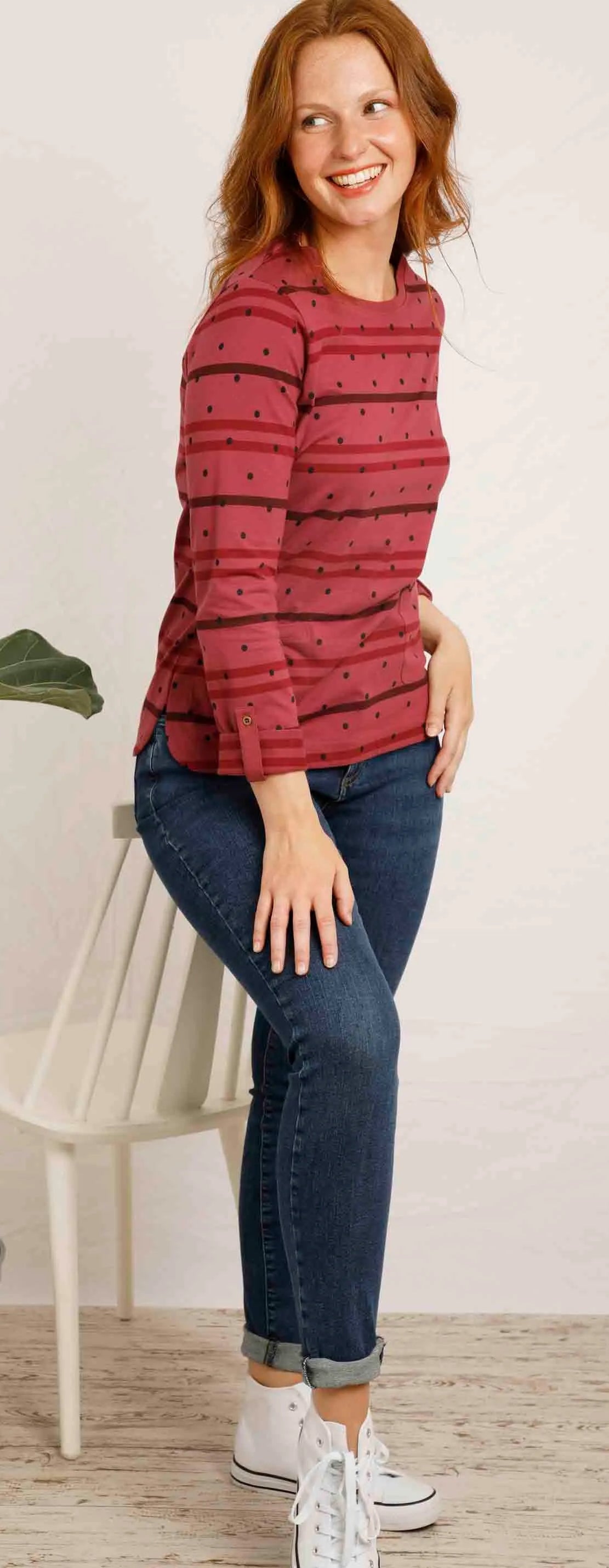 A women's crew neck long sleeve Billie tee from Weird Fish in Crushed Berry with a stripe and dotty pattern, made from an organic cotton fabric with roll up sleeves.