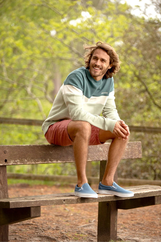 Crew neck men's long sleeve sweatshirt from Brakeburn in a blue, teal or green block stripe pattern.