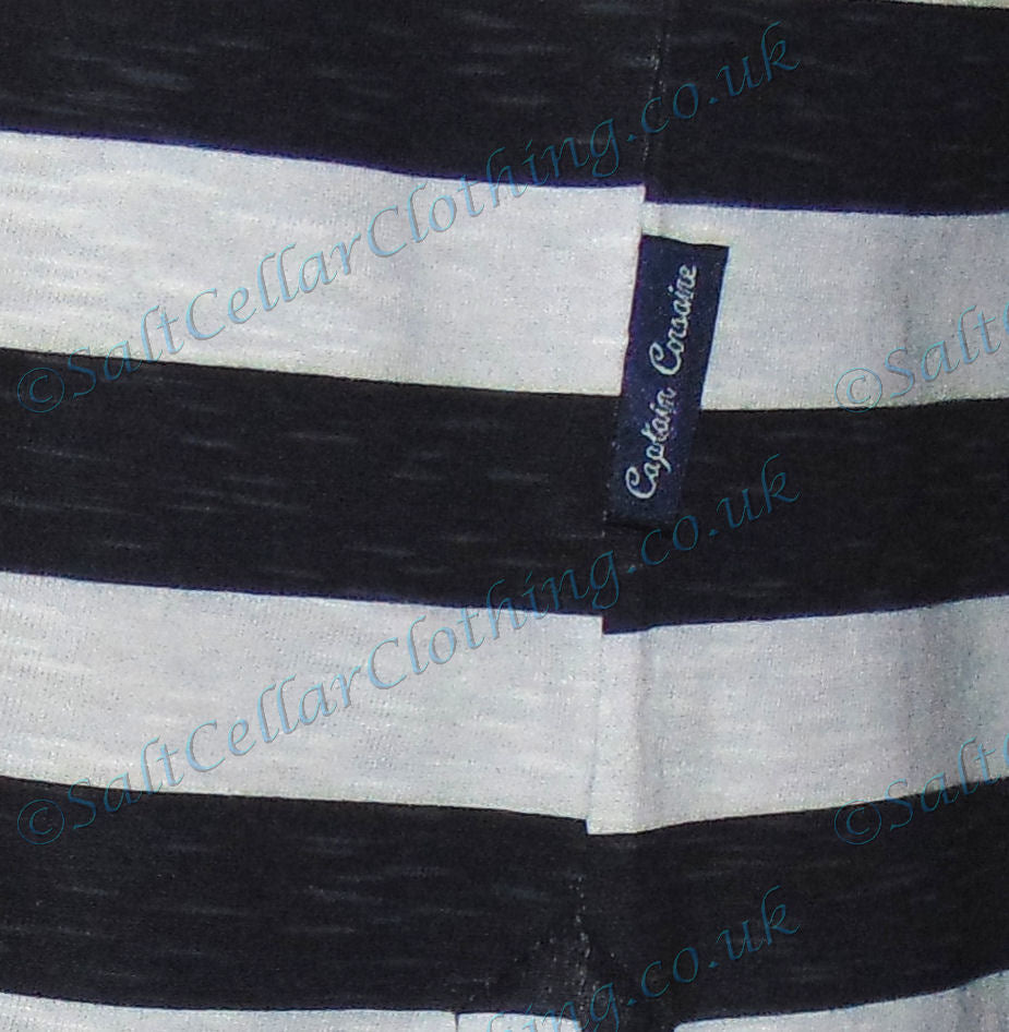 Close-up of Captain Corsaire white navy stripe dress fabric with brand label